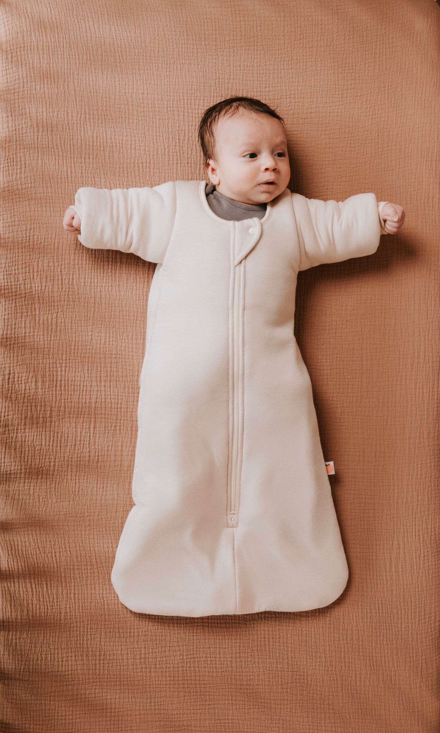 Time to transition out of the swaddle? Then it's time for the Dreamy Peach Co. Transition Sleep Sack! It blunts the startle reflex, while keeping baby safe and cozy. Makes dropping the swaddle a breeze.