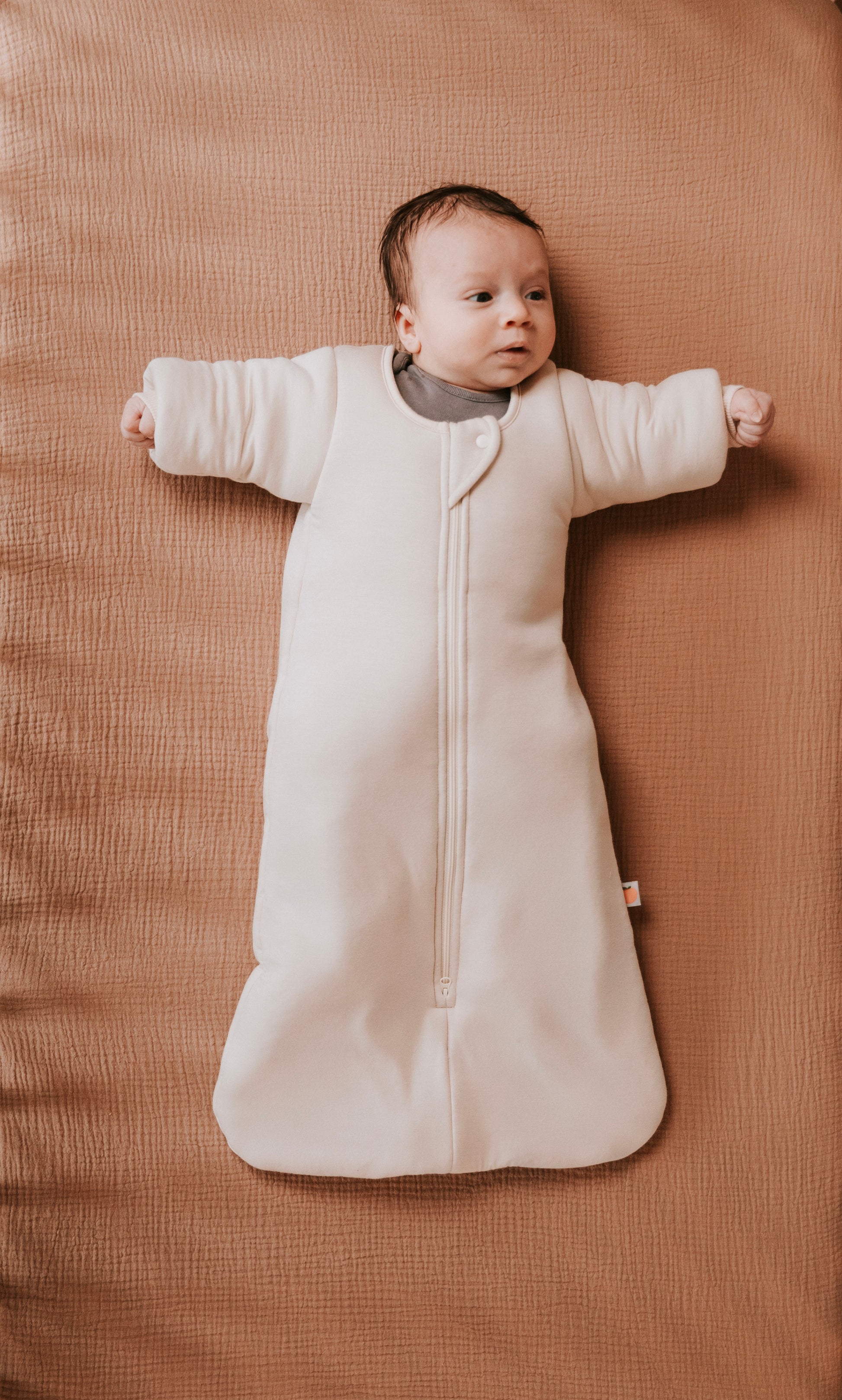 Time to transition out of the swaddle? Then it's time for the Dreamy Peach Co. Transition Sleep Sack! It blunts the startle reflex, while keeping baby safe and cozy. Makes dropping the swaddle a breeze.