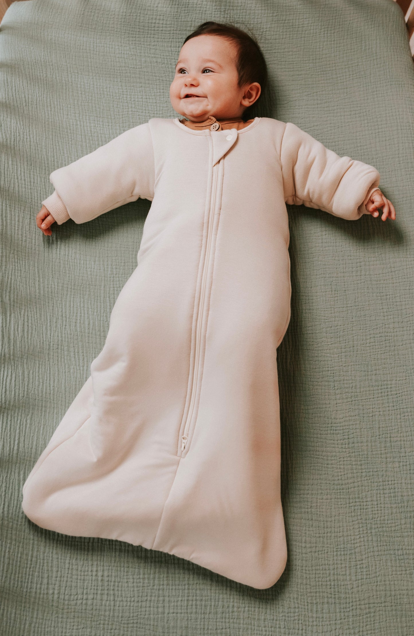 Time to transition out of the swaddle? Then it's time for the Dreamy Peach Co. Transition Sleep Sack! It blunts the startle reflex, while keeping baby safe and cozy. Makes dropping the swaddle a breeze.