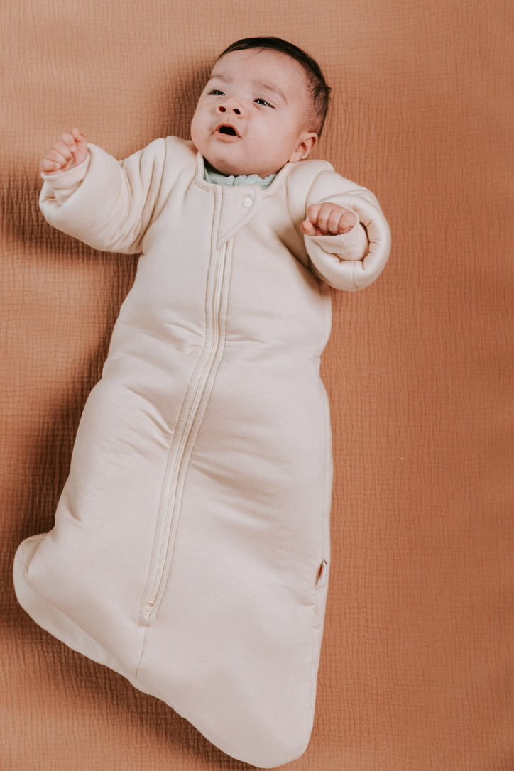 Time to transition out of the swaddle? Then it's time for the Dreamy Peach Co. Transition Sleep Sack! It blunts the startle reflex, while keeping baby safe and cozy. Makes dropping the swaddle a breeze.