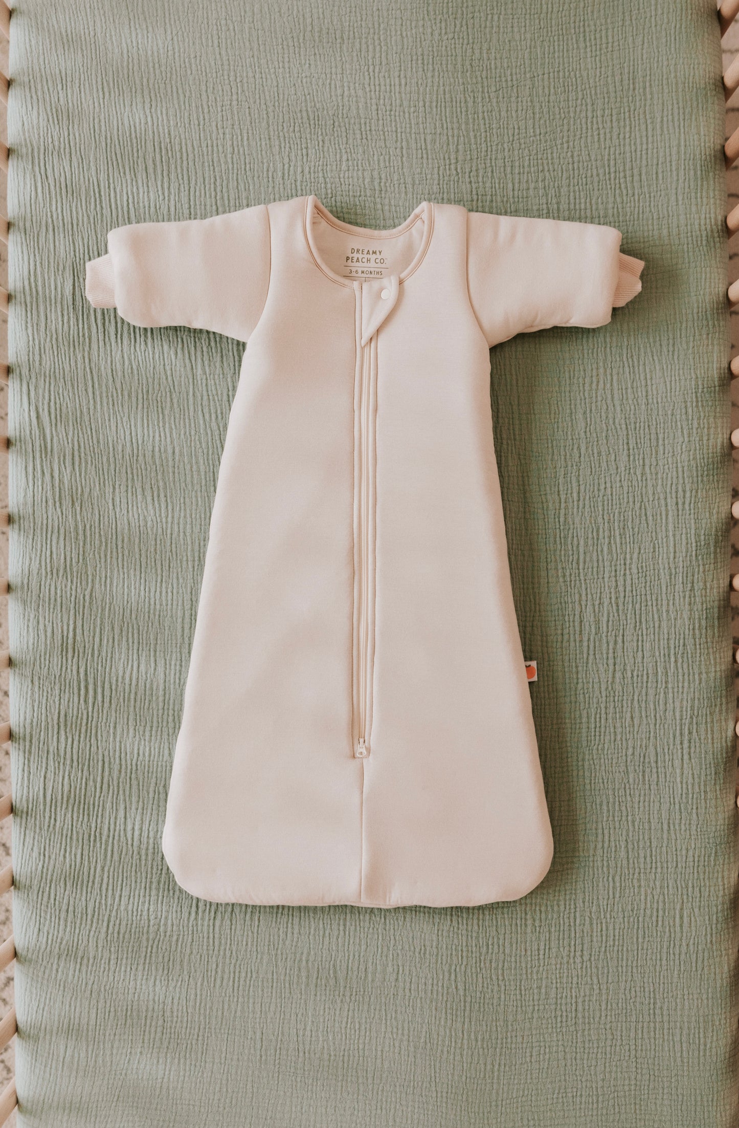 Time to transition out of the swaddle? Then it's time for the Dreamy Peach Co. Transition Sleep Sack! It blunts the startle reflex, while keeping baby safe and cozy. Makes dropping the swaddle a breeze.